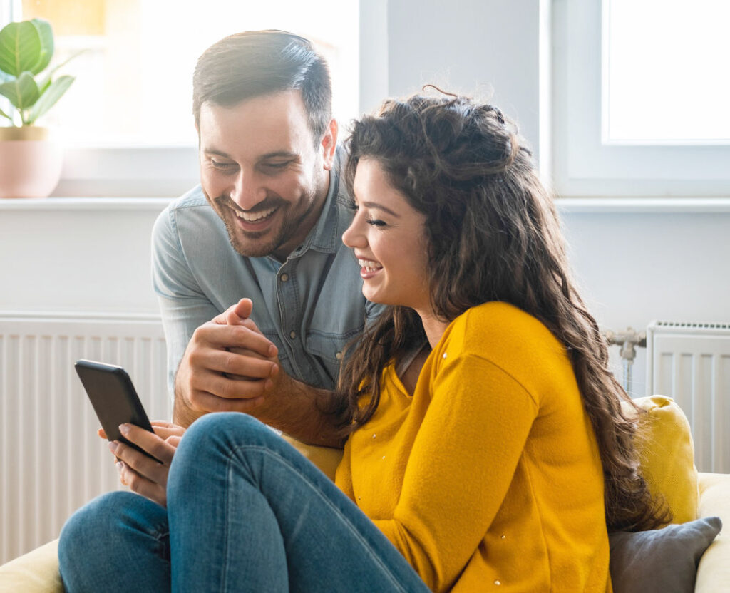 EmpathyMe Couple looking at phone together